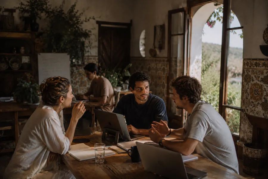 Founders working together at the villa
