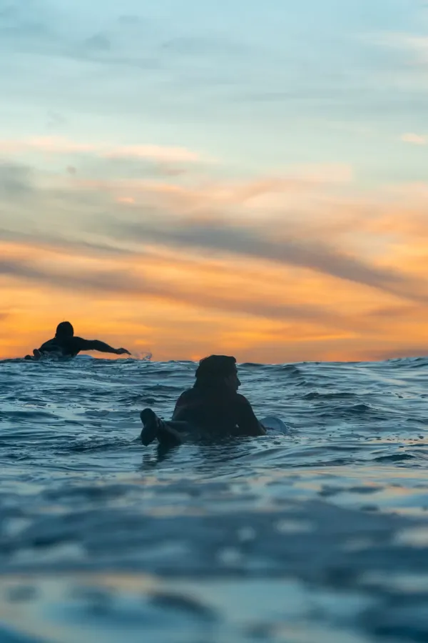 A surfer at sunset